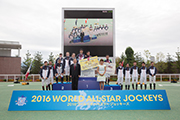 Joao Moreira (front row, 2nd left) and other participating jockeys smile for cameras at the World All-Star Jockeys series trophy presentation ceremony.