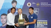 Kitchee Head Coach Chu Chi-kwong (left), player Lam Zhi-gin Andreas (right) present grass from their pitch as a souvenir to thank the Club for its help in constructing the Jockey Club Kitchee Centre.