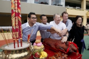Photo 4, 5, 6<br>
Senior Club officials cut the roasted pigs at the bai-sun ceremony.
