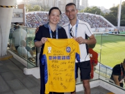Champion Jockey Joao Moreira presents a jersey with Jockeys autographs to Cluba?s Executive Director, Corporate Planning, Communications and Membership Scarlette Leung.