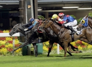 Super Turbo (blue cap, inside) opens his Hong Kong account over 1200m at Happy Valley last season.