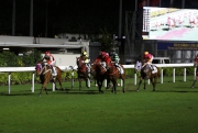 Dinozzo (red and black silks) finishes a creditable third in his Hong Kong debut at Happy Valley.