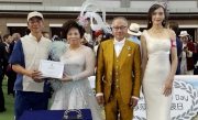 Sa Sa International Holdings Limited Chairman and CEO Dr. Simon Kwok and Vice-Chairman Dr. Eleanor Kwok, together with Sa Sa Ladies�� Purse Day ambassador Tiffany Tang, present a prize of HK$2,000 to the Stable Assistant responsible for Helene Paragon, the Best Turned Out Horse in the Sa Sa Ladies' Purse.