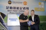 Club Chief Executive Officer Winfried Engelbrecht-Bresges (right) and Manchester United Academy Player Development Manager Les Parry sign a football with the Cluba?s and Manchester Uniteda?s logos. 