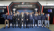 From 4th left to right, front row: Club��s Executive Director of Racing Authority, Andrew Harding, Club��s Chief Executive Officer, Winfried Engelbrecht-Bresges, Club��s Deputy Chairman, Anthony Chow, and Club��s Executive Director of Racing Business and Operations, Anthony Kelly take a group photo with owners, trainers and jockeys at the ceremony.