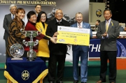 The Hong Kong Jockey Club CEO Winfried Engelbrecht-Bresges presents a HK$250,000 prize cheque to Edward Chan Kwok Man & Karen Chan Ka Yin, Owners of the Happy Valley Million Challenge first runner-up Happy Spirit.