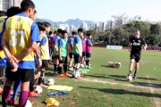 Hong Kong Head Coach of Manchester United Soccer School Christopher O'Brien conducts (right) on-site football coaching session. 

