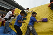 Zone 9 aᡧ Inflatable World: Children and parents demonstrate courage and skills with giant inflatables!