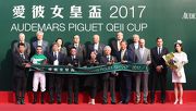 Chairman, Stewards and CEO of The Hong Kong Jockey Club, senior officials from Audemars Piguet and the connections of race winner Neorealism, pose for a group photo at the Audemars Piguet QEII Cup trophy presentation ceremony.