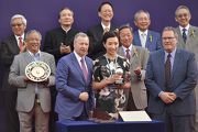 Winfried Engelbrecht-Bresges (front row, left), Chief Executive Officer of the Hong Kong Jockey Club, presents a trophy from the 2017 Global Sprint Challenge to the representative of Lucky Syndicate, owner of Lucky Bubbles.