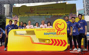 The Club's Head of Charities (Grant Making - Sports, Recreation, Arts & Culture) Rhoda Chan (4th right) joins Under Secretary for Home Affairs Florence Hui (6th left) and the Chinese YMCA of Hong Kong's Vice President Joshua Yau (5th right), General Secretary Karl Lau (5th left) and Ambassadors to launch the project.