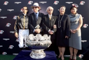 Dr. Cornel Li and his family with Joao Moreira and John Moore at the presentation ceremony for the 2014 LONGINES Hong Kong Mile.