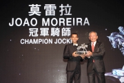 Joao Moreira receives the Champion Jockey award from Mr. Lester Kwok, Steward of HKJC.