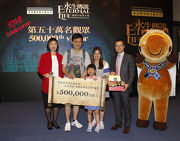 The Cluba?s Executive Director, Charities and Community, Leong Cheung (2nd right), joined by Director of Leisure and Cultural Services, Michelle Li (left), presents a souvenir pack to Hailey Tsoi (3rd left), the 500,000th visitor to the The Hong Kong Jockey Club Series: Eternal Life aᡧ Exploring Ancient Egypt exhibition, who is also welcomed by mascot Captain JC of the Cluba?s a?Progressing Together Cheering Teama?. The nine-year-old Hailey is very excited to meet the mummies. Her mother Mrs Tsoi says she hopes the Club can support more exhibitions of this kind, which give children the chance to gain knowledge from the rare exhibits, a more effective experience than just reading story books.
