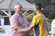 Club Executive Director, Racing Business and Operations Anthony Kelly (left) arrives at Mong Kok Stadium to cheer for the jockeys and local football legends participating in the exhibition game.