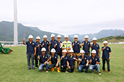 Members of the Conghua Training Centre tracks team, including Mr Jackson Wong (back row, centre) celebrate the completion of turf laying at CTC in May 2017.