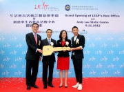 Club Steward Michael T H Lee (2nd left) and the Cluba?s Executive Director, Charities, Douglas So (1st left) hand over a symbolic key to the two new Life Education Centres to LEAP Chairman Chitty Cheung (2nd right) and LEAP Health Ambassador Andy Lau (1st right). 