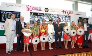 Chairman T. Brian Stevenson (fifth from right), Director of Home Affairs Pamela Tan (sixth from left) and other guests pose with the minority dance performers.