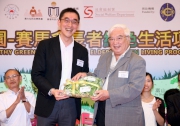 The Cluba?s Executive Director, Charities, Douglas So (left) receives a souvenir from MHG Honorary Consultant Dr Lau Wah-sum (right).