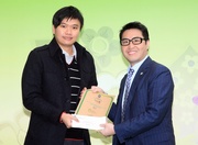 The Club!|s Executive Director of Marketing Richard Cheung (right) presents a certificate to the winner of the Logo Design Competition for water bottles.
