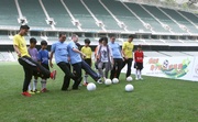 Officiating guests kick off the Jockey Club Youth Football Scheme 2011.
