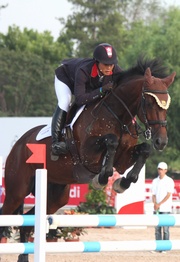 Club-sponsored rider Samantha Lam rides a faultless round in the 2011 FEI World Cup Jumping China League, earning her top position after the first leg of the competition.