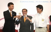 Club Chairman T Brian Stevenson (centre); Secretary for the Environment Edward Yau (right) and BEC Chairman Prof John Chai (left) toast the 21st Anniversary of the Council.