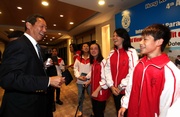 Club Deputy Chairman and President of Hong Kong Equestrian Federation Dr Simon S O Ip (left) and Hong Kong team members celebrate at the cocktail party.