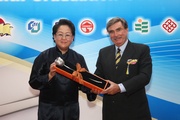 The Club Chairman T Brian Stevenson (right) presents a token of appreciation to keynote speaker Ada Wong (left).