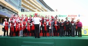 Club CEO Winfried Engelbrecht-Bresges (6th from the right, 1st row) and senior management, legislator The Hon Chan Hak-kan (4th from the right, 1st row) and other guests of honour get the Green Carnival off to a festive start with Christmas carols.