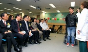 Lo Hing Tung, user of the Jockey Club Special Wheelchair Bank, demonstrates how easily to stand up with the assistance of the wheelchair.