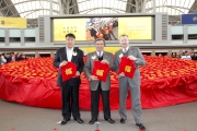 Hong Kong Jockey Club Chairman T Brian Stevenson (centre) joins Chief Executive Officer Winfried Engelbrecht-Bresges (right) and Vice-Chairman of Tung Wah Group of Hospitals Frederick Fung King-wai (left) to launch the Cluba?s Other Learning Experiences programme, and witness the creation of the worlda?s largest goody bag.