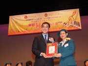 The Cluba?s Executive Director, Charities, Douglas So (left) receives certificate of appreciation from the Hong Kong Girl Guides Association Deputy Chief Commissioner Silkie Lee (right).
