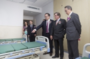 Photo 5, Photo 6<br>Club Chairman T Brian Stevenson joins Club Stewards Anthony Chow and Dr Donald Li as well as other guests on a tour of the new Mianyang 3rd City Hospital HKJC Medical Complex.
