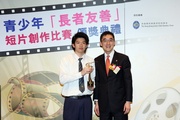 The Cluba?s Executive Director, Charities, Douglas So (right) presents Best Director Award to student of Lok Sin Tong Leung Kau Kui College (left).