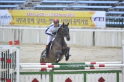 Kenneth Cheng, a member of the HKJC Equestrian Team, finishes fourth in an individual competition for senior riders at the same event.