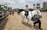 Children enjoy pony rides at the Open Day.