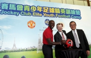 Jockey Club Chief Executive Officer Winfried Engelbrecht-Bresges (centre), Manchester United legend Dwight Yorke (left) and Hong Kong Football Association Chairman Brian Leung (right) sign on the MU football.