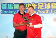 The Cluba?s Chief Executive Officer Winfried Engelbrecht-Bresges (right) presents a bronze horse to Manchester United legend Bryan Robson (left).