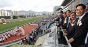Deputy Director of the Liaison Office of the Central Peoplea?s Government in the HKSAR Li Guikang (third from right) and Deputy Commissioner of the Ministry of Foreign Affairs of the Peoplea?s Republic of China in the HKSAR Hong Xiaoyong (first from right) watch the Hong Kong Reunification Cup race with Club Chairman T Brian Stevenson (second from right); Stewards Dr Eric Li Ka Cheung (fifth from right) and Legislative Council member the Hon Ip Kwok-him (fourth from right). 