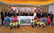 The Cluba?s Executive Director, Charities, Douglas So (back row, 8th left); Kitchee Foundation Chairman Ken Ng (back row, 6th left); Hong Kong Football Association Chairman Brian Leung (back row, centre) and The Kitchee-Escola Parents Association Chairman Dr Philip Poon (back row, 4th left) with Kitchee Foundation Executive Committee members; Kitchee footballers; students of the Kitchee-Escola and other guests.