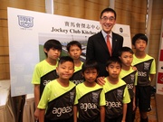 The Cluba?s Executive Director, Charities, Douglas So and students of the Kitchee-Escola.