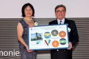 Club Chairman T Brian Stevenson (right) presents two sets of objects to PolyU Council Chairman Marjorie Yang (left) for a time capsule at the JC Innovation Tower. 