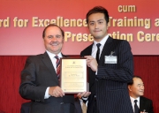 (Right) The Cluba?s Senior People Development Specialist Takki Chan collects the HKMA Outstanding New Trainer Award 2012.