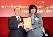 (Right) The Cluba?s Senior People Development Specialist Gloria Kam collects her HKMA Outstanding New Trainer Award 2012.