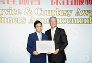The HKRMA 2012 Service and Courtesy Awards earned by the Club in the Retail (Services) category at supervisory level is presented by Legislative Councillor Hon Vincent Fang Kang to Branch Supervisor Alan Chow (left).