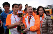 The Cluba?s Chief Executive Officer Winfried Engelbrecht-Bresges (2nd right) and TWGHs Chairman Viola Chan (1st right) present a trophy to winners of the 5-km Challenge Race (Male Group).