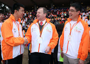 The Club's Chief Executive Officer Winfried Engelbrecht-Bresges (centre), Executive Director, Charities, Douglas So (right) and local outstanding athlete So Wah-wai (left).
