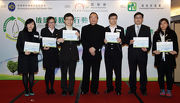 Club Steward Stephen Ip (centre) presents the certificate of recognition to the partners of the project