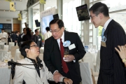 The Cluba?s Executive Director, Charities Douglas So (right), Equal Opportunities Commission Chairman Dr York Chow (centre) and Direction Association for the Handicapped Chairman Lee Yuen-tai (left).